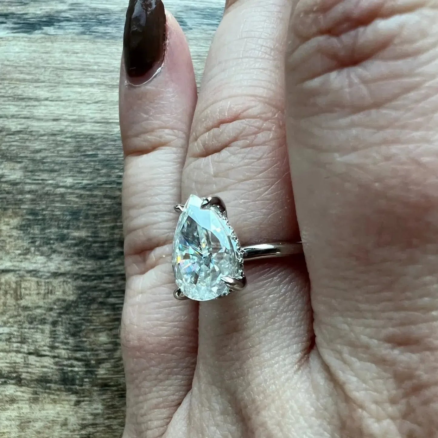 The Calista Crushed Ice Pear Cutt Moissanite Ring (Rose)